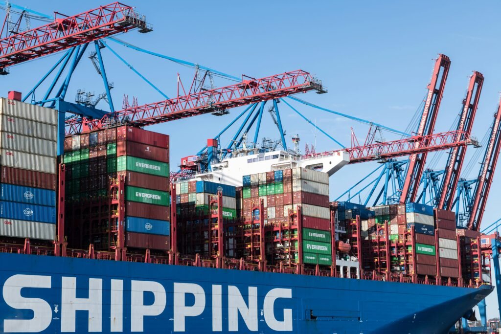 Shipping containers and cranes at Hamburg port showcasing global trade.